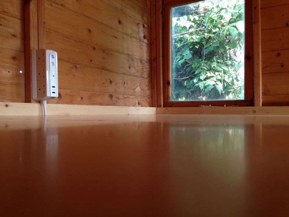 The clean ply surface of the workbench.