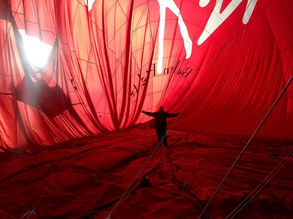 Me standing inside the recently landed hot air balloon envelope. This was an amazing experience.